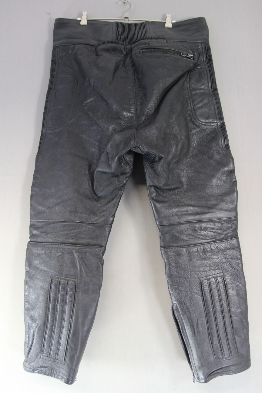 JTS BLACK LEATHER BIKER TROUSERS: WAIST 38 INCH/INSIDE LEG 27 INCH (SHORT FIT)